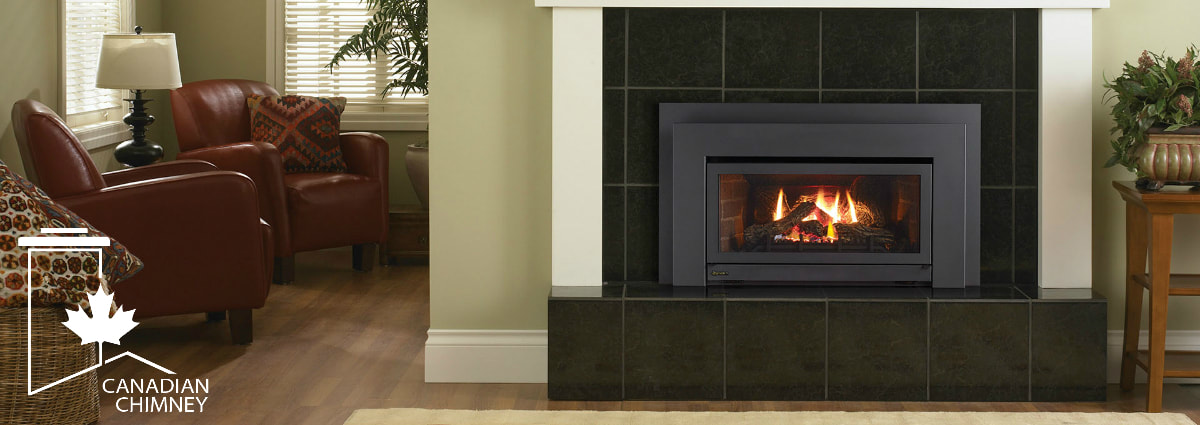 Regency gas fireplace insert installed inside stone faced masonry fireplace